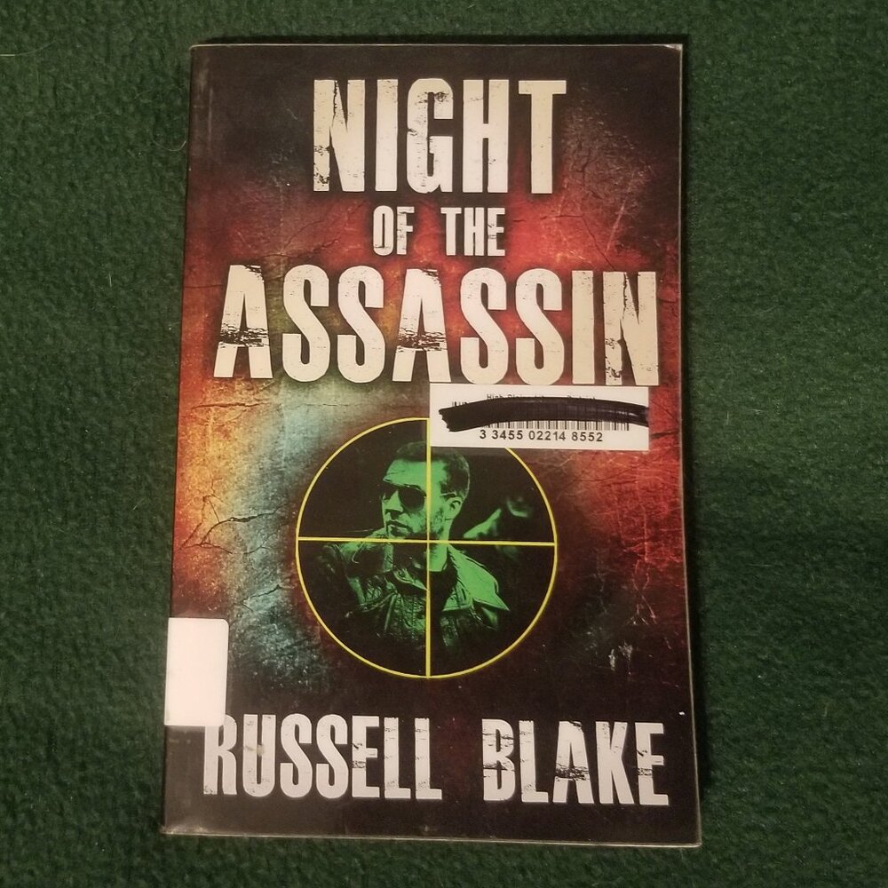 Russell Blake's Night of the Assassin paperback, ex-library